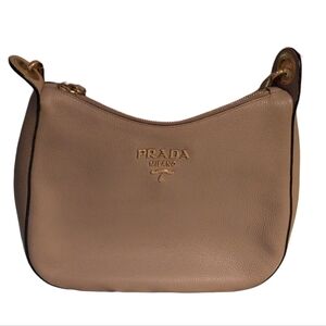 Prada Vitello Phenix leather web stripe crossbody bag in caramel brown. 